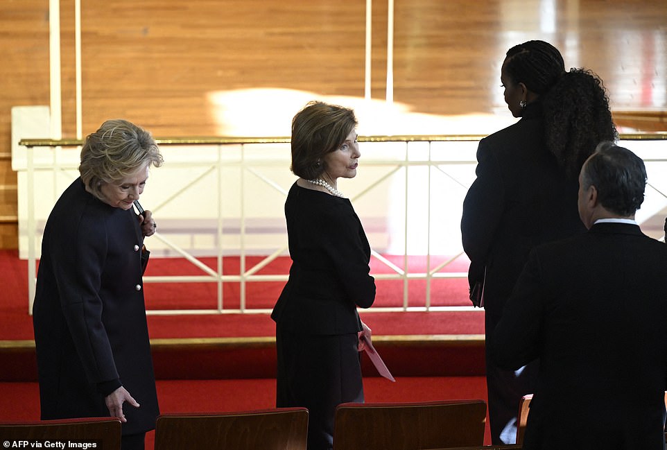 She was the first to walk into Glenn Memorial United Methodist Church in Atlanta, Georgia and take a seat at the end of the first row next to the aisle.  Mrs. Trump was followed by Mrs. Obama, Laura Bush and Hillary Clinton as they took their seats in that order.