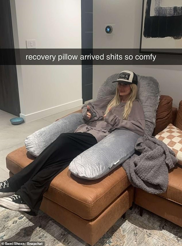 Recovery period: The model also gave her fans a glimpse of her recovery, uploading a photo taken while she rested with a 'comfy' pillow