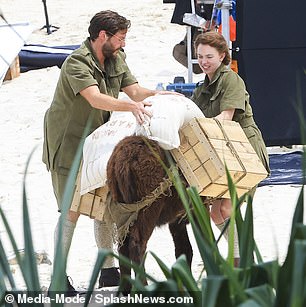 The White Lotus star was joined by Brühl to film a scene with the animal, and the Alienist star wore a similar ensemble to Sweeney