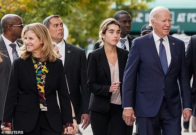 President Joe Biden, his granddaughter Natalie Biden and University of Pennsylvania President Elizabeth Magill walk into the University of Pennsylvania Penn Bookstore on October 7, 2022
