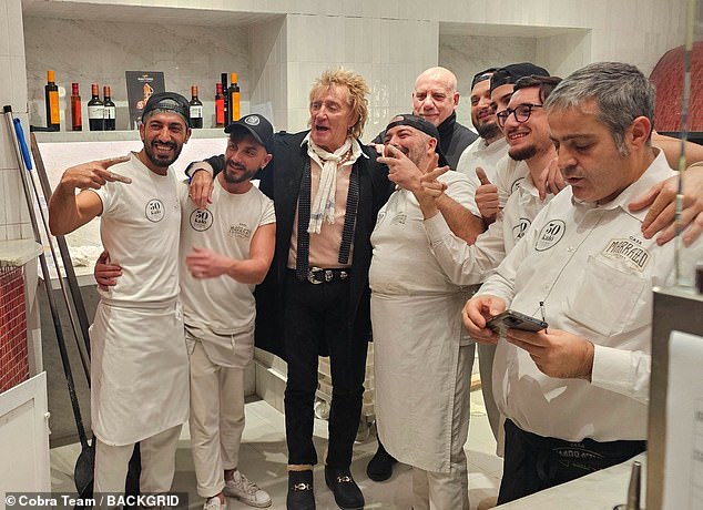 Despite the club's loss that afternoon, Rod looked in good spirits that evening as he chatted with his friends before posing for photos with the restaurant staff.