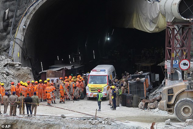 An ambulance waits to transport workers from the site of an under-construction road tunnel that collapsed in Silkyara in the northern Indian state of Uttarakhand, India, Tuesday, November 28, 2023