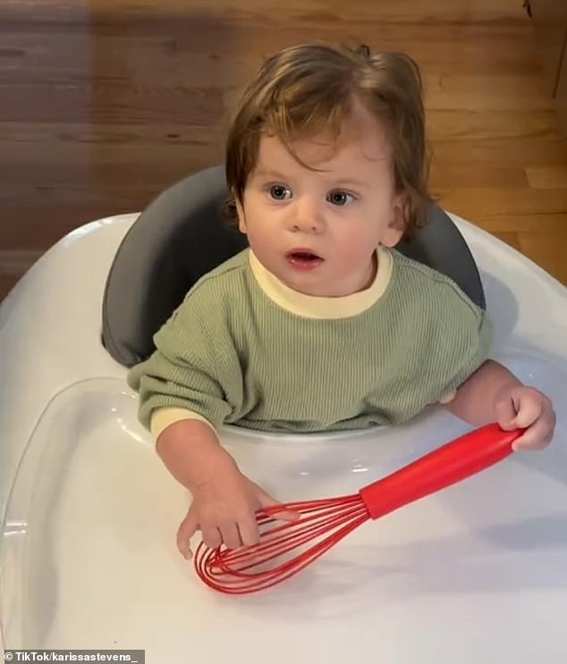 Stevens showed her daughter playing with a red silicone whisk in her walker.  “She loves her whisk,” the mother explained