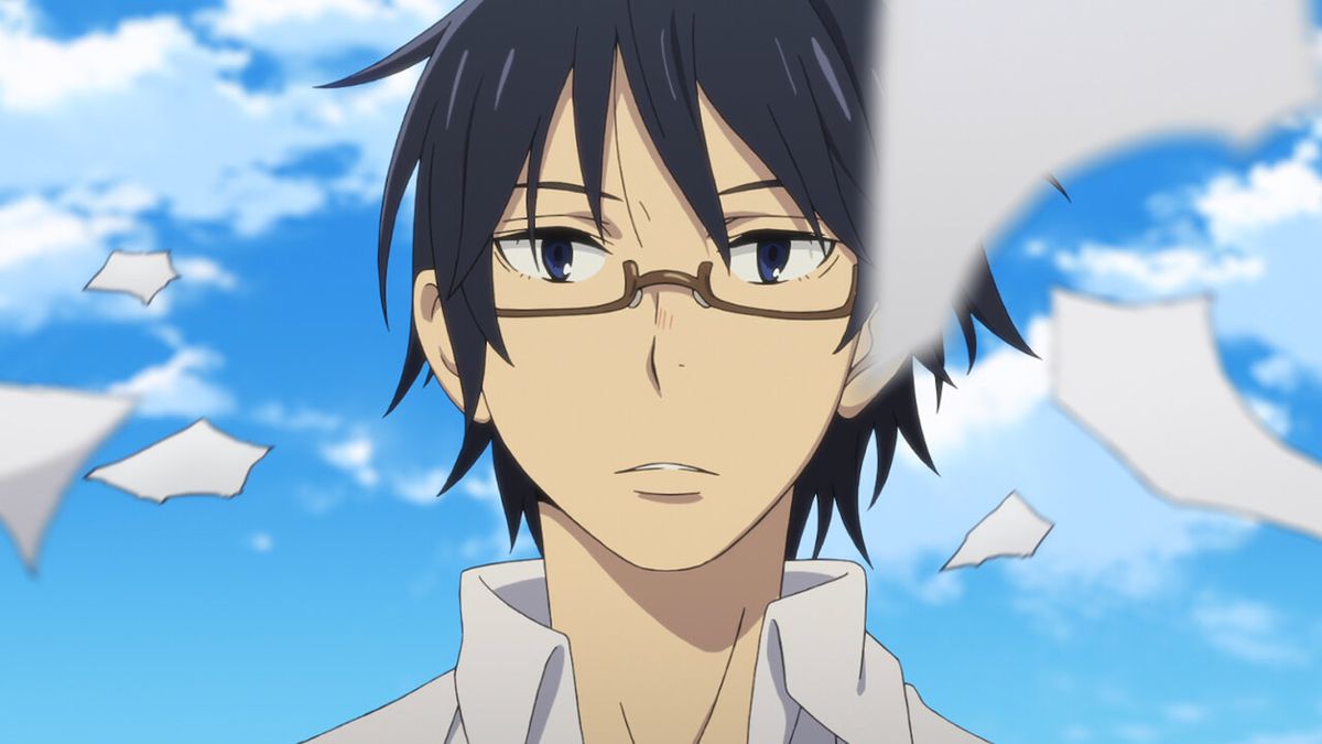 A black-haired anime character (Satoru Fujinuma) with glasses stares at scraps of paper in Erased.