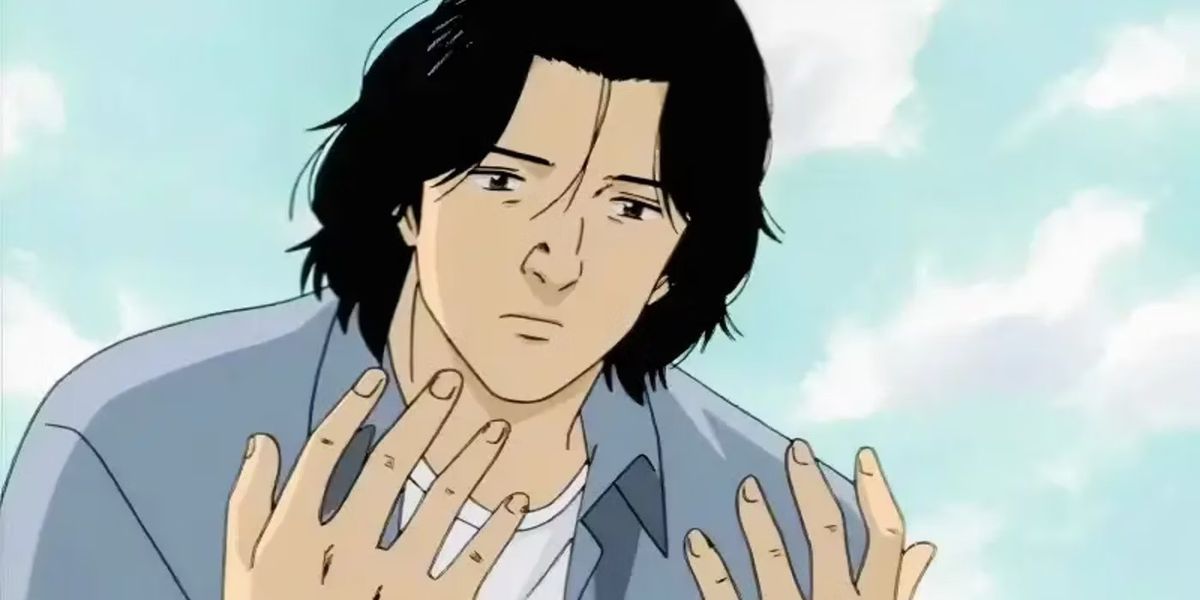 Kenzo Tenma stares solemnly at his hands in Monster.