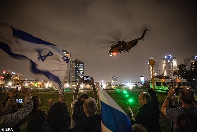 Israelis cheer this weekend as an army helicopter carrying recently freed hostages takes off