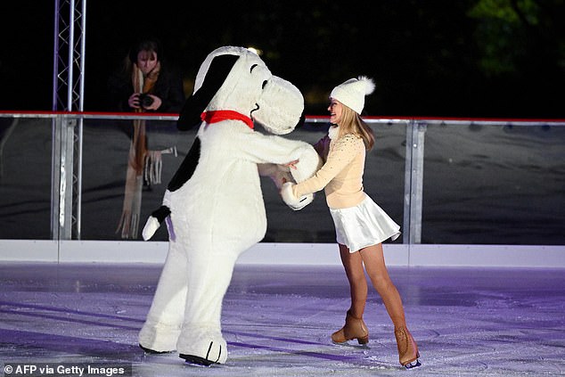 American figure skater Kimberly Navarro (right) performs with Snoopy