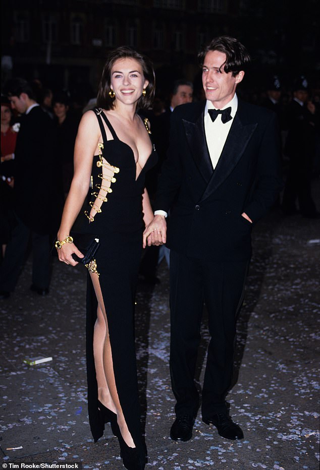 Elizabeth, 58, wore the floor-length dress - held together by safety pins - to the premiere of Four Weddings In A Funeral with her then-boyfriend Hugh Grant