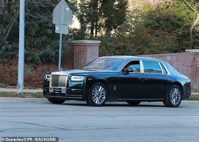 Kelce is seen behind the wheel of his $400,000 Rolls-Royce Ghost on Wednesday