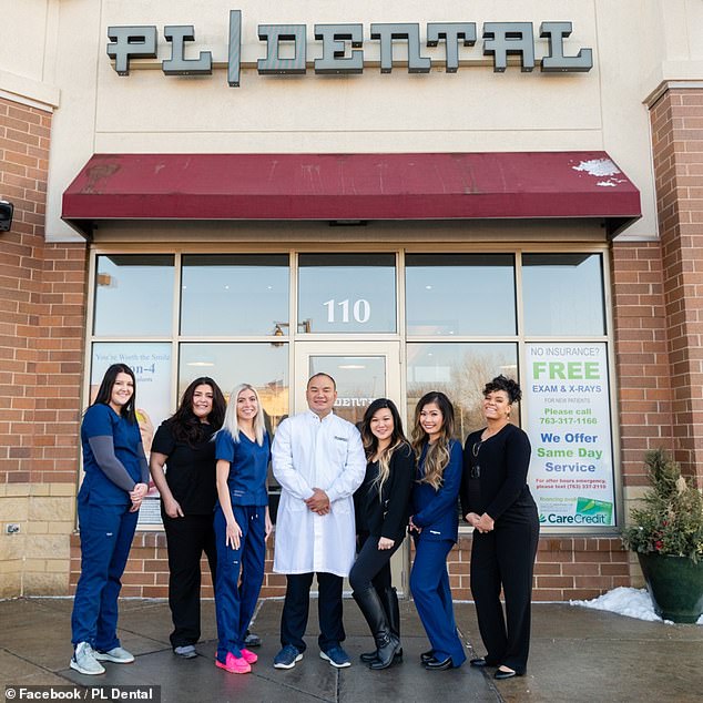 She is pictured with her colleague (far right) in front of her former workplace