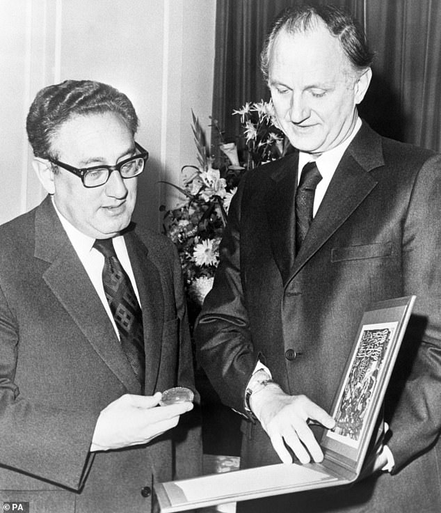 Kissinger receiving his Nobel Peace Prize from Mr Thomas Byrne, US Ambassador to Norway, at Claridge's Hotel, London in 1973