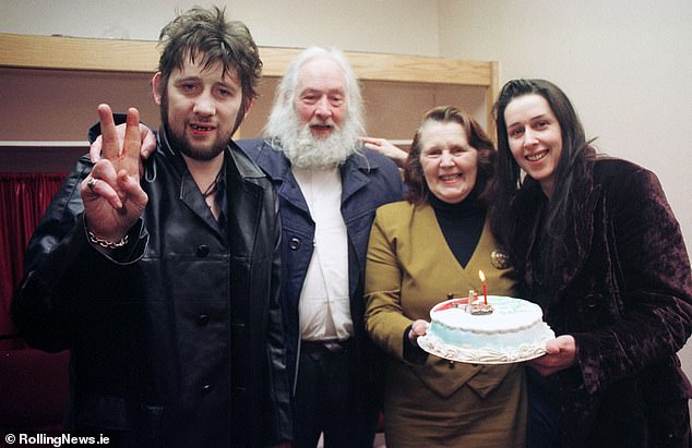 Shane celebrates his 40th birthday with a cake with his father Maurice, mother Therese and sister Siobhan before appearing on the Late Late Show in 1997