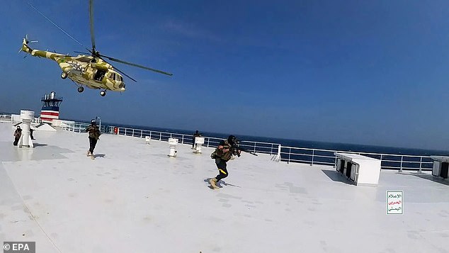 Footage filmed by Iranian-backed rebels shows them approaching the Bahamian-flagged 'Galaxy Leader' ship by helicopter in the southern Red Sea