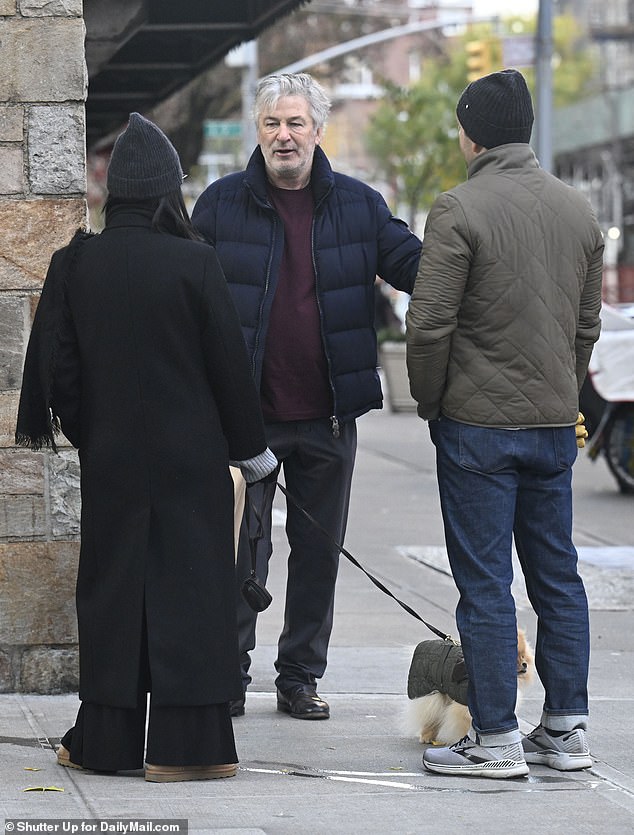 Baldwin chatted with a couple on the street in New York during his morning bagel run