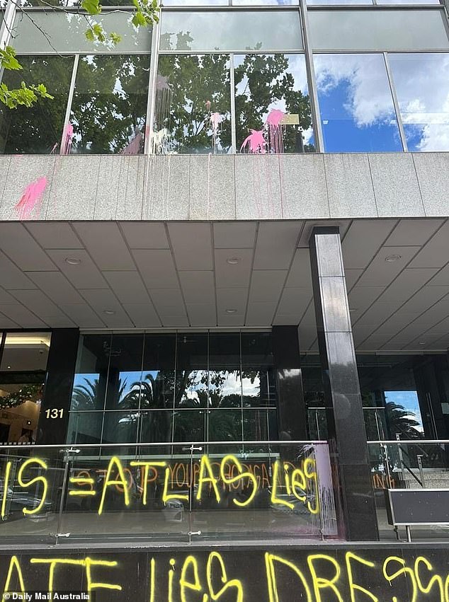 The group defaced the building's porch and lobby with graffiti at 2 p.m. on Thursday