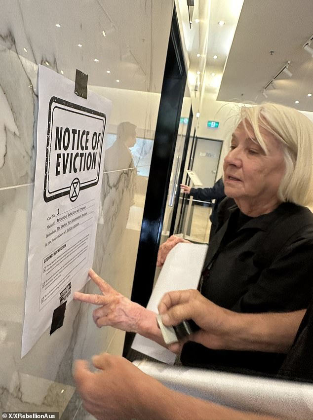 One protester, Trish, was seen actively applying graffiti to the interior of the lobby and posting several eviction notices on the walls