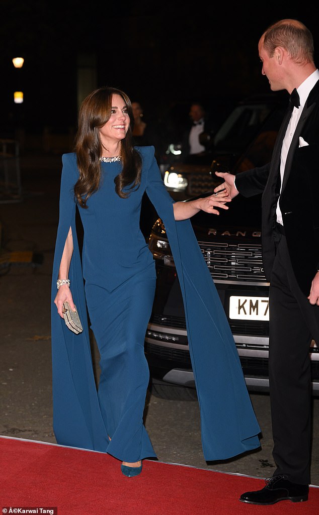 Pricne William, ever the gentleman, took Kate's hand as she walked onto the red carpet to enter the Royal Albert Hall