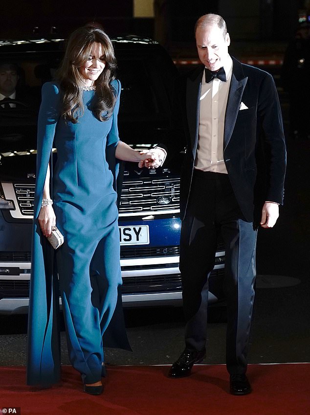 Prince William held his wife's hand as she stepped onto the red carpet in a friendly gesture