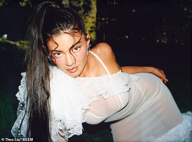 Jenner later donned a sheer white dress that showed off her curvy physique during another promotional shoot