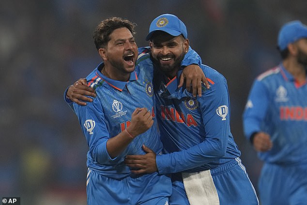 India's Kuldeep Yadav celebrates England captain Jos Butler's wicket with Shreyas Iyer