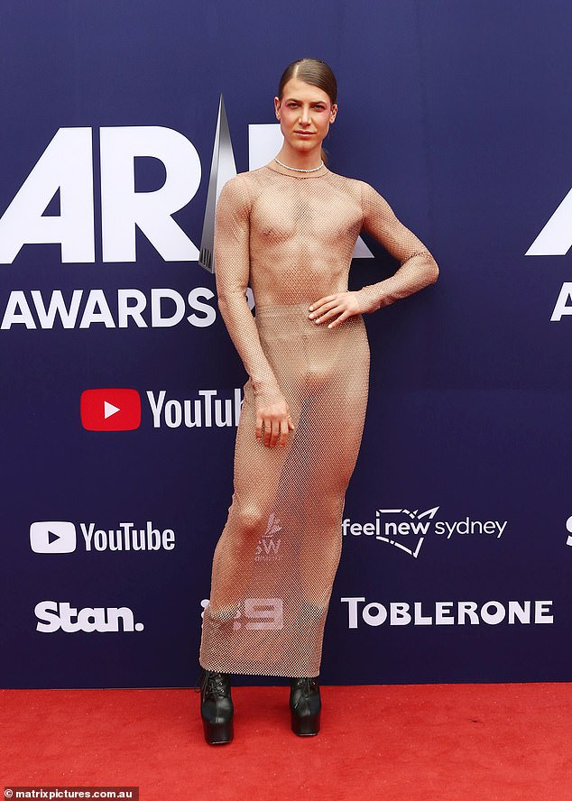 Christian Wilkins wore a VERY revealing sheer dress as he led the stars down the red carpet at the 2023 ARIA Awards