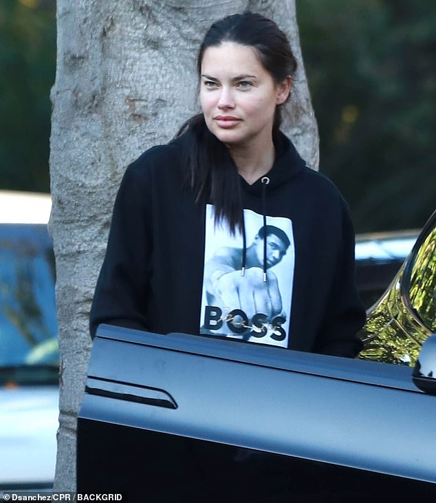 Natural look: Adriana Lima stepped out for a makeup-free walk with her supportive husband on Thursday after clapping back at shocked fans who called her 'unrecognizable' on the red carpet