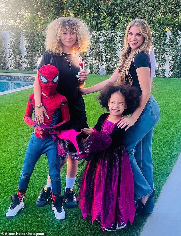 Spooky and scary: Allison Holker, 35, and their three children Zaia, three, Maddox, seven, and Weslie, 15, got into the Halloween spirit on Wednesday