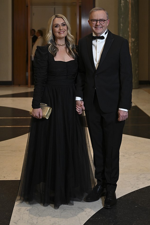 Prime Minister Anthony Albanese (pictured with his partner Jodie Haydon) has been struck after Royal Australian Navy divers were injured in an incident involving a Chinese warship off the coast of Japan