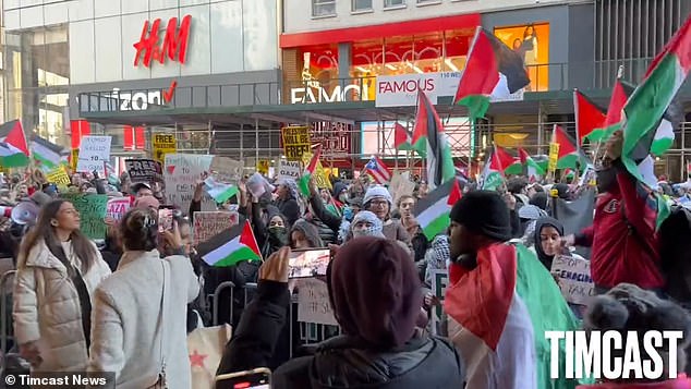 Protesters outside the Macy's flagship store in downtown Manhattan Friday shouted at people as they went inside to shop