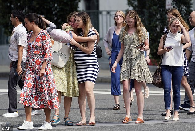 Some raised their hands as they left the government building during a false alarm in August