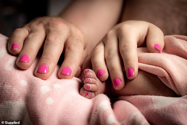 Matt and Madeline painted Wren's nails pink as a connection to her big sister Edie