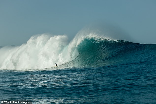 Enever is in this photo somewhere under tons of water after being dumped by the monster wave - but her world record still counts