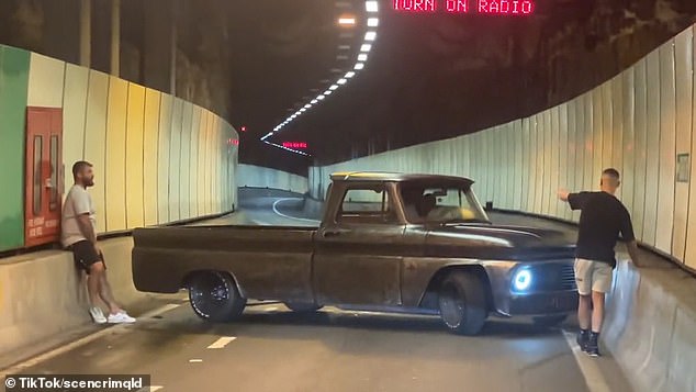 Two men could be seen directing the stuck driver, who eventually had to reverse out of the tunnel