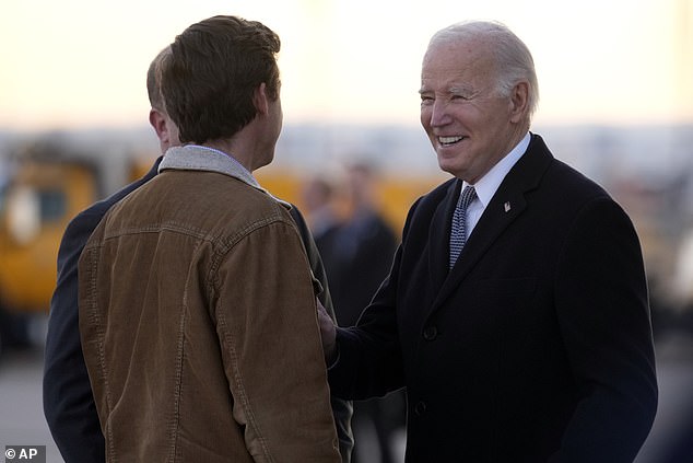 President Biden is set to meet with Rep. Lauren Boebert during a trip to Colorado.  Here he greets Colorado Governor Jared Polis and Denver Mayor Mike Johnston