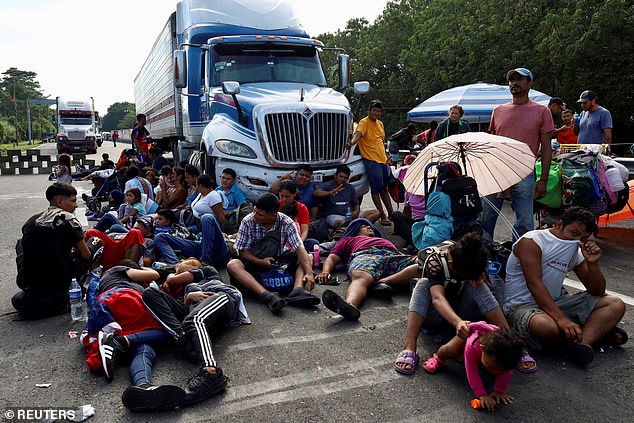 Migrants stage a protest on their way to the US, where Republicans say they are a costly drain on resources