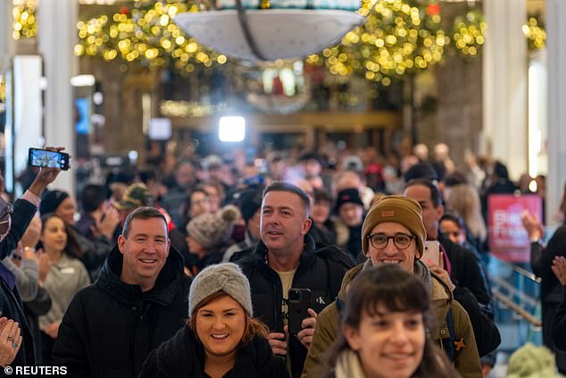 Shoppers enter Macy's department store during Black Friday shopping in Manhattan