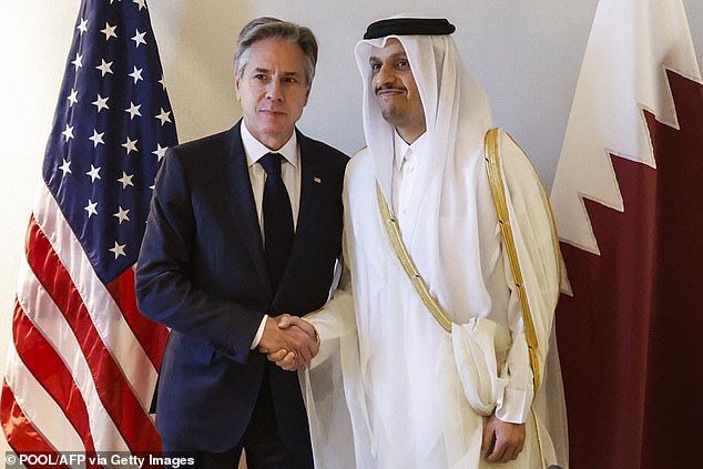 US Secretary of State Antony Blinken (left) shakes hands with Qatari Prime Minister and Minister of Foreign Affairs Mohammed bin Abdulrahman al-Thani on Saturday