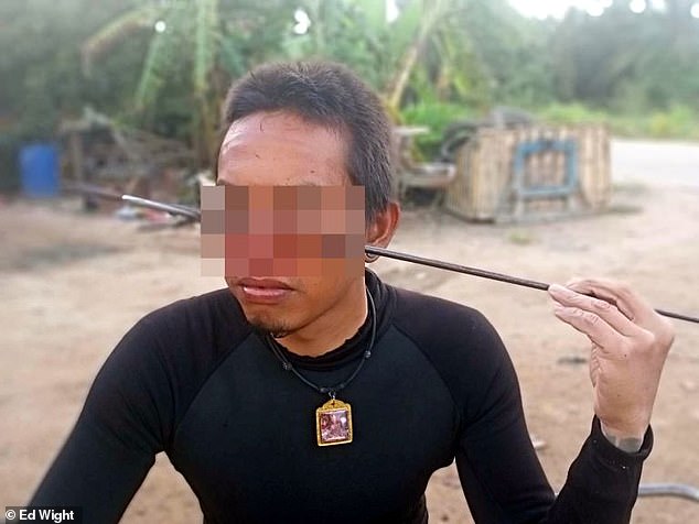 The harpoon reportedly exploded, throwing the four-foot spear into his face at Thailand's Mor Mui Reservoir