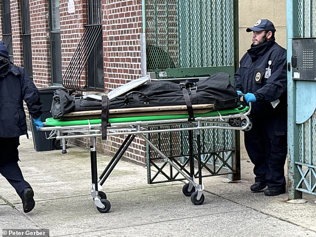 Police remove one of the victims from the scene.  Mr. Rivera was discovered in the hallway, covered in blood and with several stab wounds