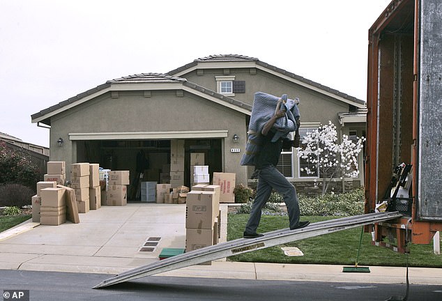 Time to leave.  A mover puts a California householder's belongings into a van as millions weigh whether the state has become too expensive