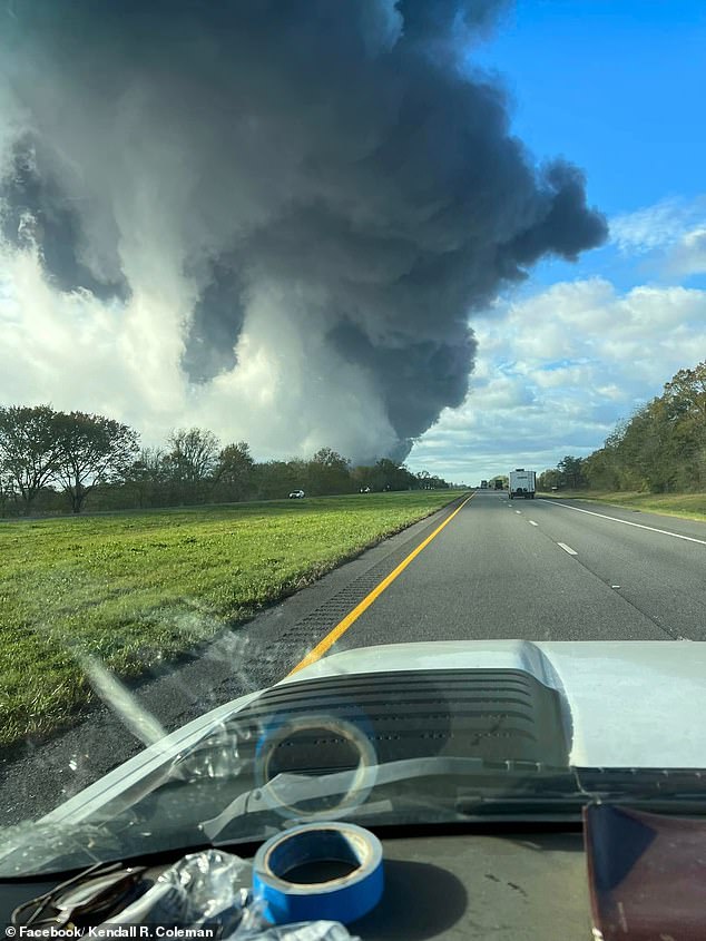 A shot of the huge plume of black smoke coming from a driver's car (photo)