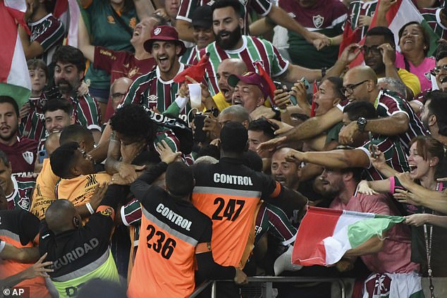 Fluminese and Boca Juniors were both reduced to 10 men in a memorable Copa Libertadores final, with striker John Kennedy shown a second yellow card for jumping into the crowd (pictured)