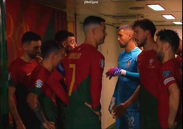 Cristiano Ronaldo (centre) and Bernardo Silva (right) looked stunned by a half-time talk from Portuguese teammate Bruno Fernandes (third from left) on Sunday evening.