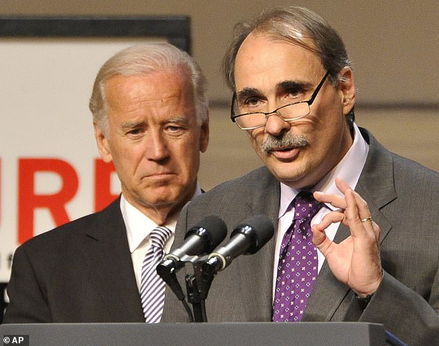 Former Obama campaign adviser David Axelrod (right) introduces then-Vice President Biden at an event in 2011. Now, after recent polls show Biden trailing, Axelrod suggested dropping out of the 2024 election campaign.