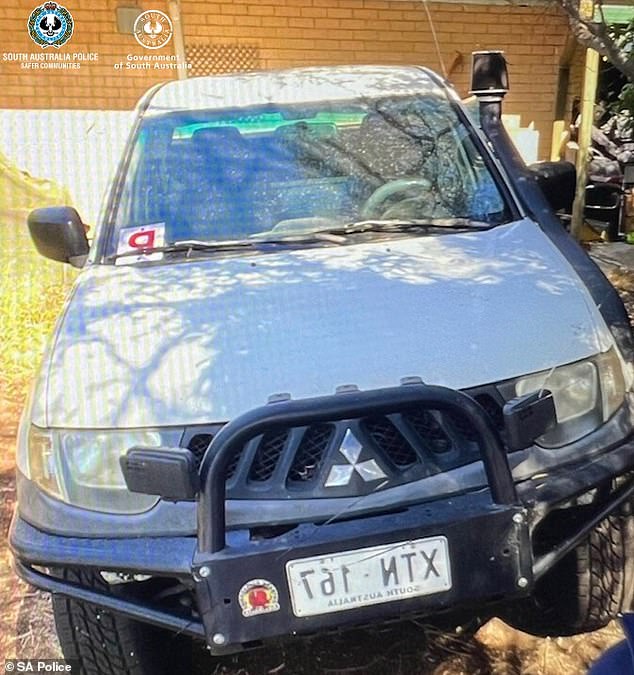 A huge manhunt has been launched for the driver of a missing Mitsubishi Ute after police found the body of a woman in an Adelaide home on Tuesday evening.