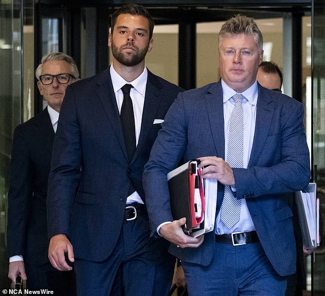 Daniel Keneally is seen wearing a black tie leaving Downing Center Court earlier this year.  He has been found guilty of making up a police statement that landed a man in jail