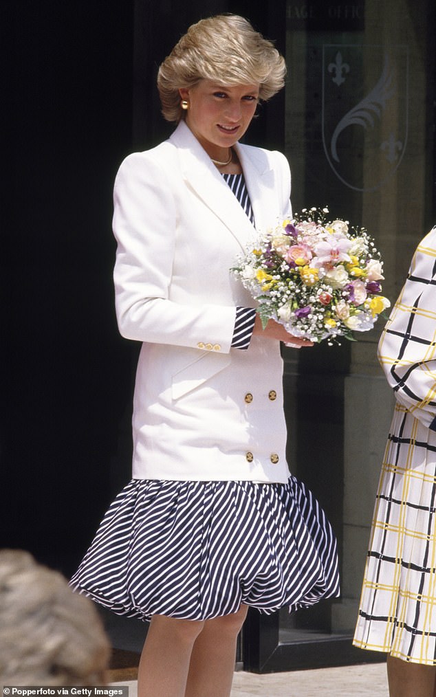 Princess Diana, wearing a navy blue and white striped dress with a puffball skirt designed by Catherine Walker, attended the Cannes Film Festival in May 1987