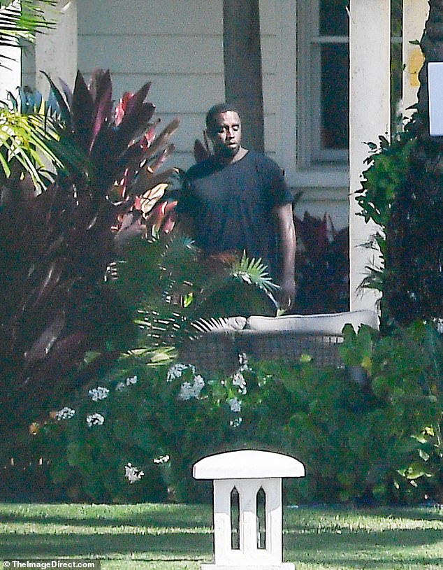 The rapper was spotted looking downcast at his estate on Star Island near Miami