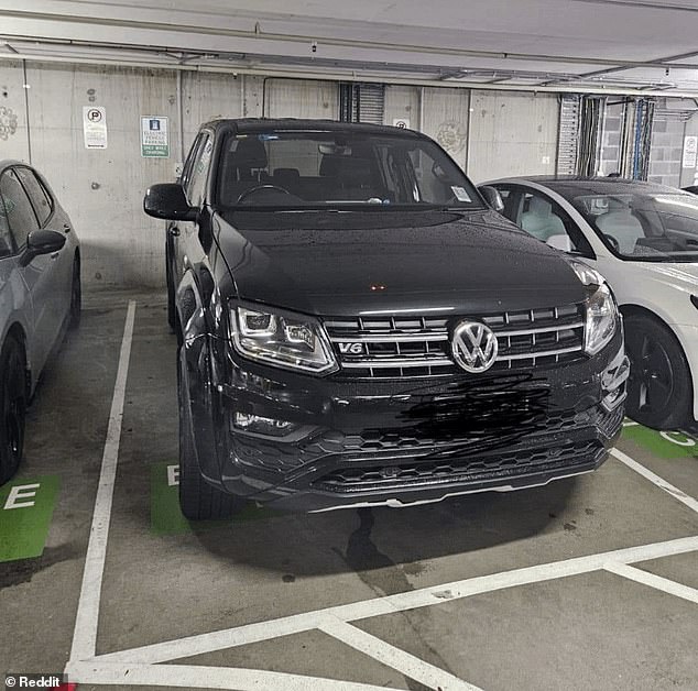 A fed-up Aussie shared a photo of the Volkswagen Amarok on Reddit with the caption: 'Ute parked in one of five EV charging slots.  Typical ute driver behavior'