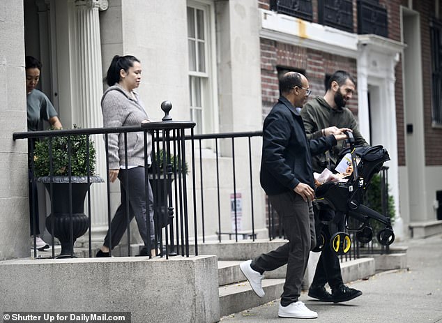 De Niro's girlfriend Tiffany Chen (left, gray sweater) was later seen leaving the Tribeca mansion and handing her baby Gia to her assistants